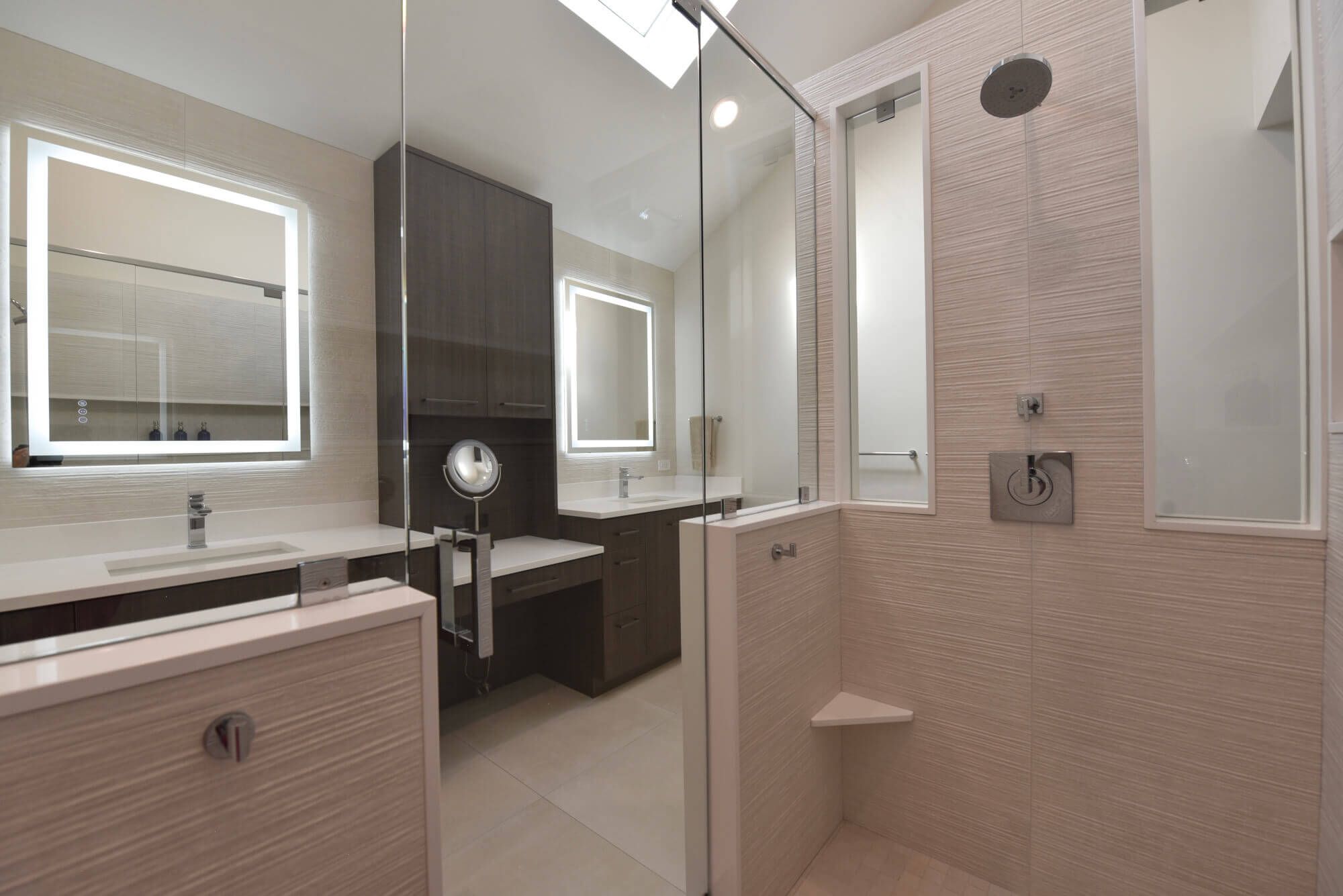 Northwest Suburbs bathroom remodel by Kelly Thayer Design featuring a porcelain tile shower with built-in foot ledge