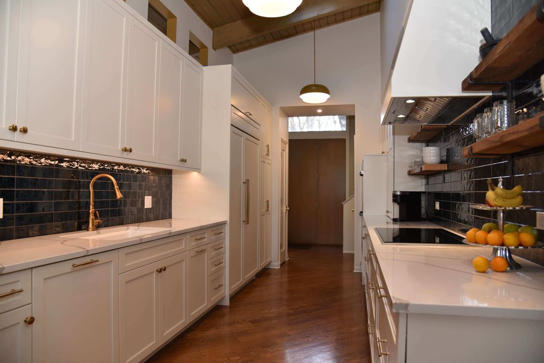 White transitional kitchen with wood floating shelves - Highland Park design by Kelly Thayer