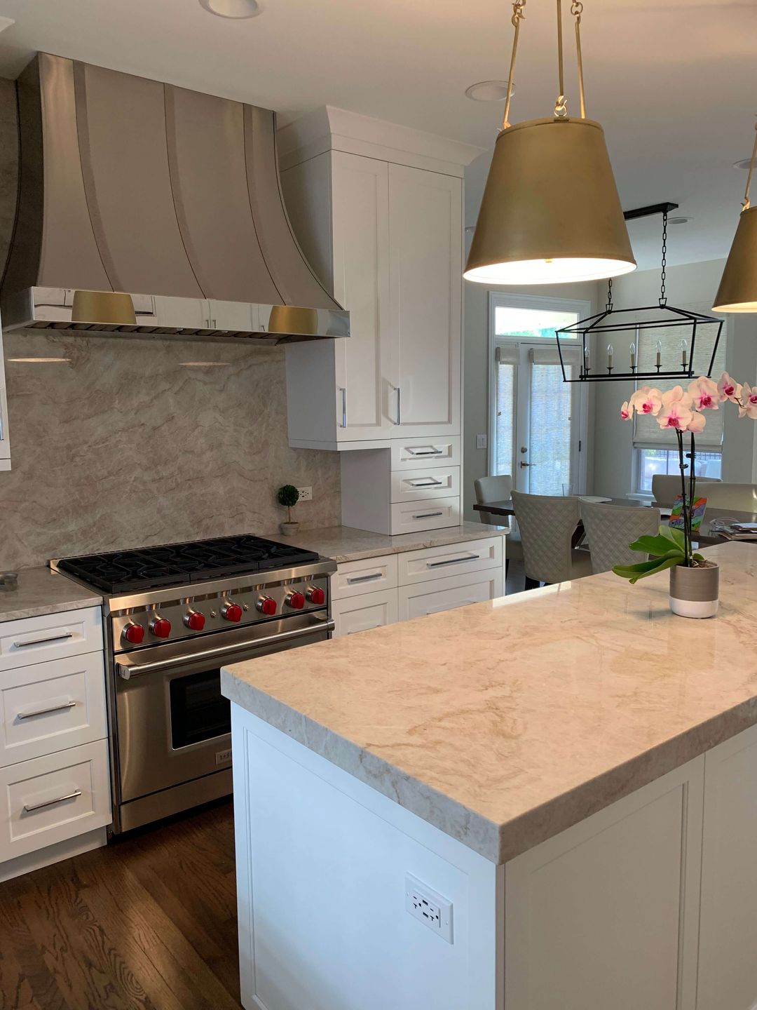 Glenview kitchen remodel custom metal hood brass pendants quartzite counters by kelly thayer
