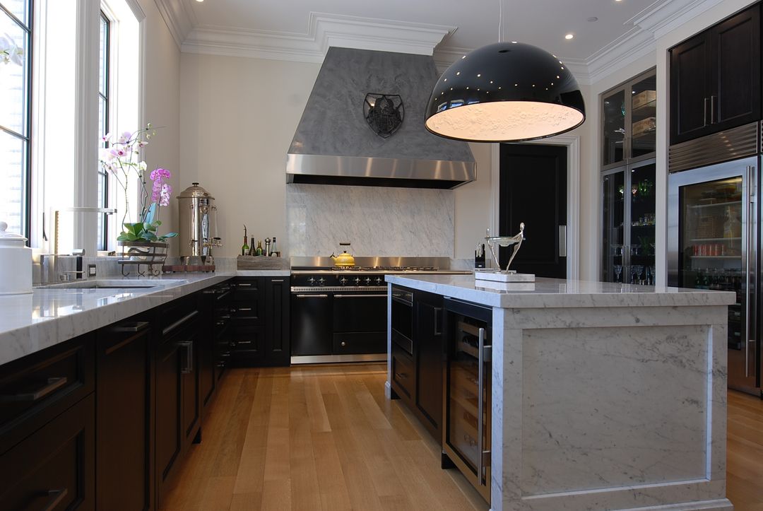 Black custom kitchen cabinetry with custom range hood - Barrington kitchen design by Kelly Thayer