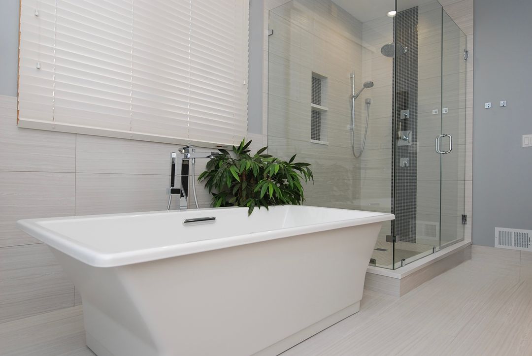 Highland Park primary bathroom remodel with freestanding tub and glass walk-in shower – Kelly Thayer Design