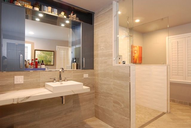 North Shore ADA curbless wheelchair-accessible shower with floating vanity and frameless glass – Kelly Thayer Design