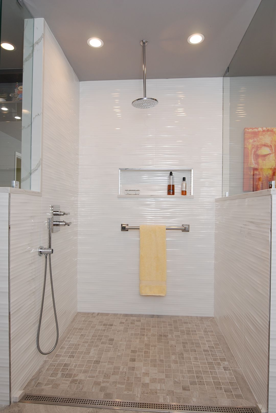 North Shore ADA curbless walk-in shower with rain head, white wave tile, mosaic floor, and linear drain – Kelly Thayer Design